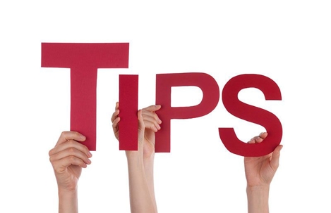 Hands holding up the letters spelling out TIPS